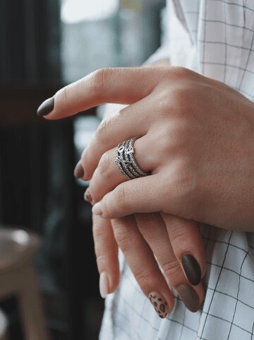 Closeup shot of a female wearing a beautiful silver ring Closeup shot of a female wearing a beautiful silver ring